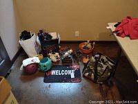 Full lot overview including skeleton figurines, baskets, pumpkin buckets, and welcome mat.