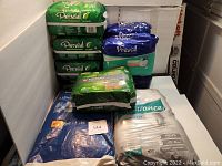 Photo of multiple unopened bags of adult diapers and underpads stacked showing different brands and sizes