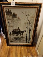 Full view of framed painting showing horse-drawn carriage and street scene.