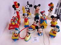 Full overview of all vintage Mickey Mouse and Donald Duck toddler toys including pull toys, figures, and train pieces.