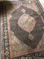 Full view of rectangular oriental style rug laid on floor
