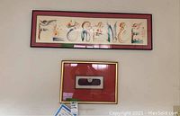 Wide view showing the framed etching titled 'Florence' by Martin Barooshian on the wall above another framed item.