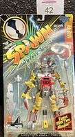 Front view of sealed SPAWN Series 7 NO-BODY action figure packaging showing character, weapons, and missile turret