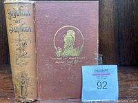 Front cover and spine of the antique 1887 book 'Samantha at Saratoga' showing title, author, publisher, and wear on cover.