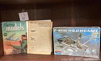 Photo showing the cover of the Flying Models magazine, insert page, and Monogram F-105G Wild Weasel model kit box.