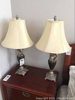 Pair view showing both lamps on wooden surface