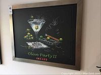 Full view of the framed print showing martini glass, olives, cigar, and title "Olive Party II" by Godard.