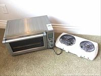 Breville toaster oven and Salton hotplate side by side on carpeted floor