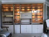 Front view of assembled wall unit with all four modules illuminated