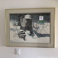 Front view of framed artwork titled "Snow Caps" depicting a snow-covered tree stump scene in winter.
