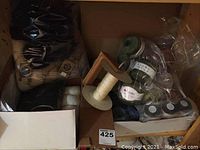 Overall view of assorted yarn skeins and spools