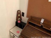 Overall view of the wood nightstand, vintage weather station, and cork message board located in a corner of the room.