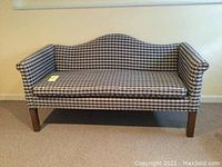 Front view of camelback settee with blue and white check slipcover, showing overall condition and design.