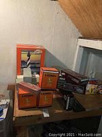Group shot of Lionel boxes, green accessory boxes, Hershey’s kits