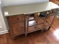 Front view of sideboard showing mirrored panels, ring pull hardware and overall condition