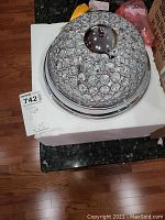 Crystal-style dome ceiling light fixture with reflective chrome finish.