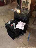 Overview of Garrard turntable stacked atop Brio amplifier, Onkyo CD player and speaker on concrete floor
