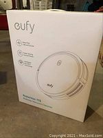 Front of Eufy RoboVac 11S box showing branding, ultra-thin profile and key features