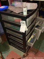 Full view of black plastic 5-drawer storage organizer containing crafting supplies.