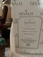 Box label showing Gevalia 1-8 cup coffeemaker, model C60-BC series, household use only, with warranty and electrical specifications.