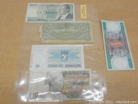 Four foreign banknotes including Turkish Lira, Hebrew text note, Burmese script note, and an older styled 10 denomination note.