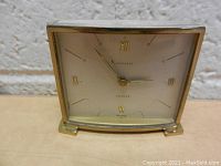 Front view of vintage Junghans clock showing dial with Roman numerals and 'Junghans 7 Jewels' markings.