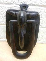 Front view of the carved wood elephant door knocker showing the elephant face and trunk ring.