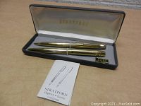 Pair of gold-tone vintage Stratford pens in original box with booklet