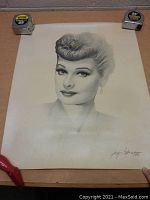 Full view of the signed Lucille Ball print showing the portrait and artist signature