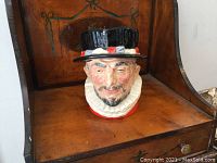 Front view of Royal Doulton Beefeater character jug showing detailed face, hat, and collar
