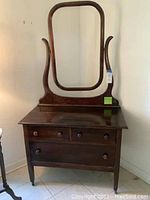 Full view of vintage wooden dresser with harp mirror frame, showing overall structure and finish.