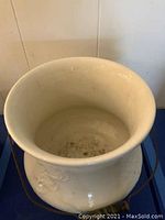 Top view of white ceramic pot showing inside bottom and rim