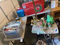 Two plastic Lifetime folding tables displayed with various other household items.