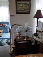 View of phone table from the side showing magazine slots and finish wear