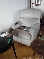 Front view showing seat, armrests, remote control