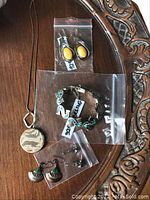 Full jewelry set displayed on wooden background.