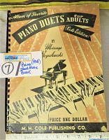 Front cover of the 1941 piano duets sheet music book showing title, author, and publisher with a ruler for scale.