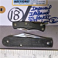 Two Imperial folding pocket knives laid next to a ruler for size reference, showing textured black handles with IMPERIAL branding