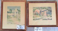Two wood-frame watercolor paintings side by side, showing the full framed artwork for the lot.