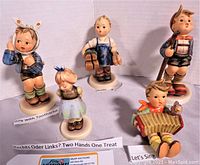 Front view showing all five Hummel figurines arranged in a semicircle with labels identifying each, including Boy with Toothache, Rechts oder Links? Two Hands One Treat, Boots, Little Hiker, and Let's Sing.