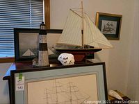 Overview photo showing all maritime decor items arranged on wooden surfaces.