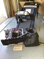 Photo showing the treadmill with exercise and sports items including tennis racquets, rollerblades, and safety equipment placed in front on the floor.