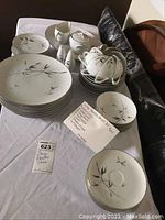 Full view of Sango china set showing plates, bowls, cups, saucers, and sugar bowl with bamboo pattern on white background
