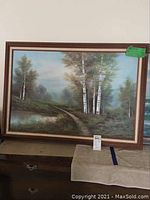Framed oil painting of a forest with birch trees along a path, signed by Martin