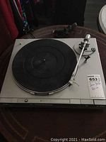 Top front view of the JVC turntable showing the platter, tonearm, and cartridge mount.