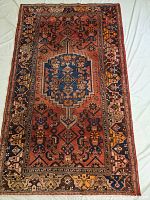 Full view of the rug laid flat showing overall pattern and border design