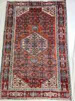 Full view of rug on white background showing complete geometric pattern