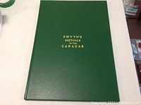 Front cover of large green hardcover book titled Smyth's Sketches in the Canadas with gold embossed text.
