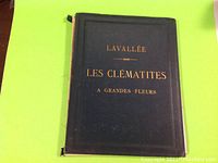 Black cloth hardcover front view with gilt lettering