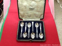 Set of six sterling silver coffee spoons in original presentation box labelled John Hall & Co Jewellers Manchester.
